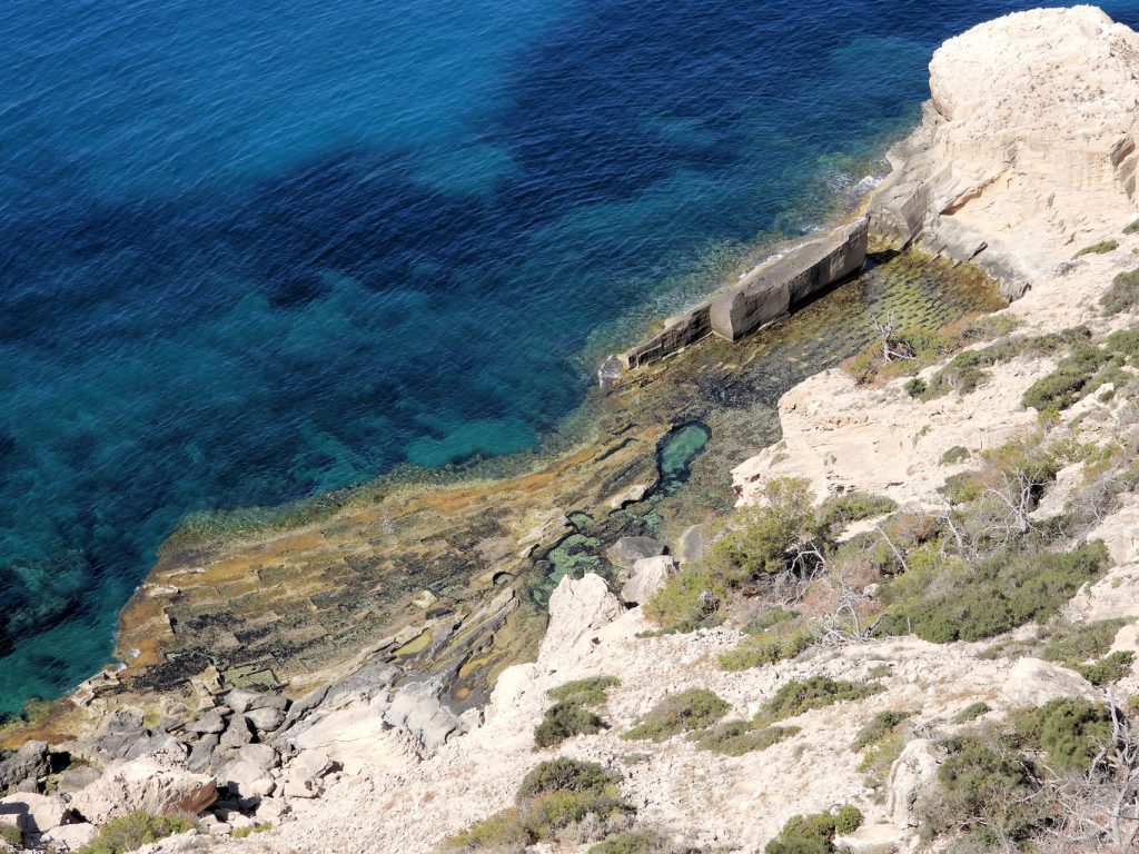 Old sandstone quarry at sea level in the Rafeubetx cove.